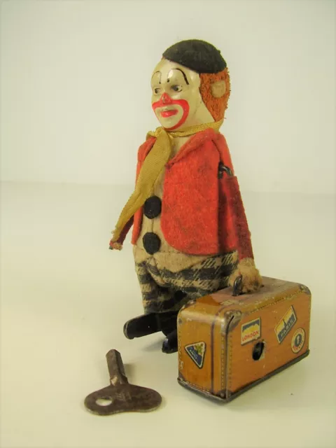 Antike Schuco Tanz Figur Clown mit Koffer vor 1945