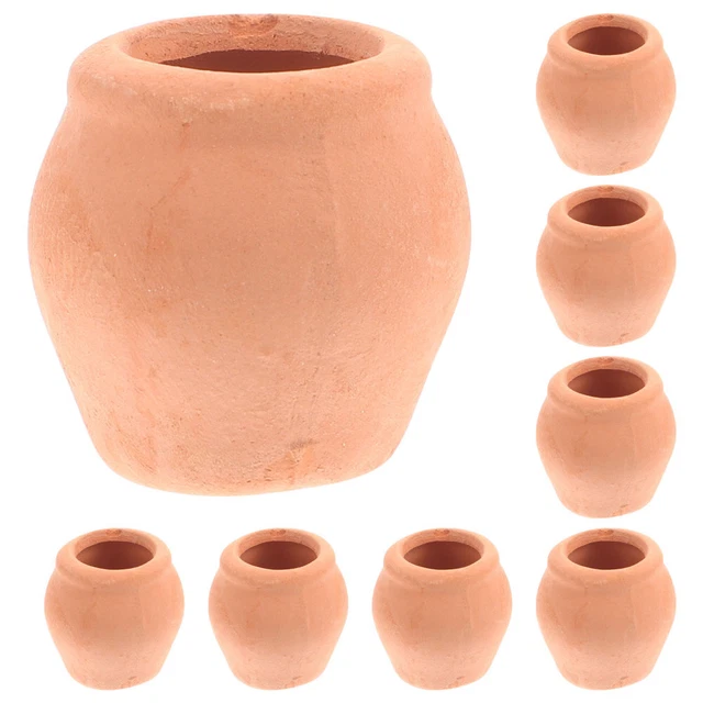 Un set di vasi in terracotta con piante grasse al loro interno. | Foto Premium