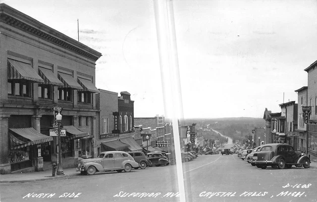 CRYSTAL FALLS Michigan postcard Upper Peninsula RPPC Superior Ave stores #56