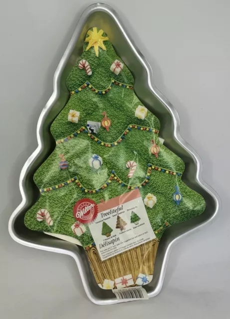 https://www.picclickimg.com/7WkAAOSwDRRlY~jg/Wilton-Christmas-Holiday-Tree-Cake-Pan-Mold-Baking.webp