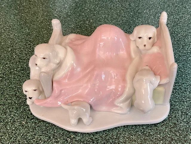 PUPPIES Figurine “ Bedtime "  Puppy Dogs Playing in Bed 4 3/4" Long