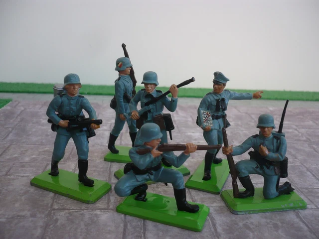 A Britains Deetail Red Trade Box, No. 7729, comprising eighteen mounted
