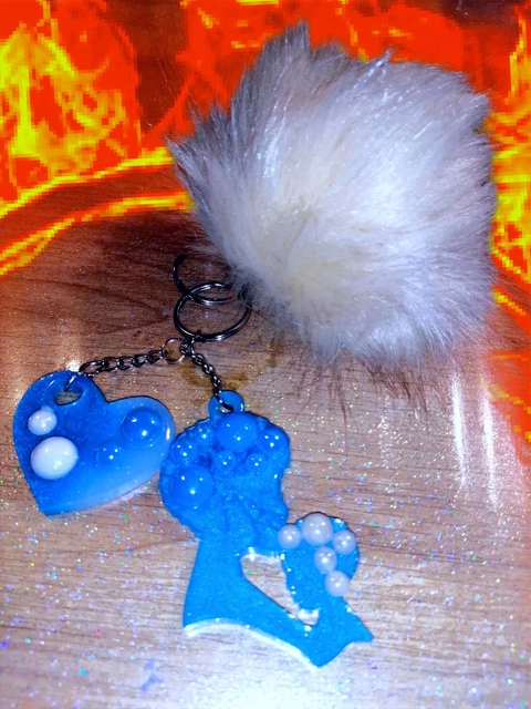 Porte clé double avec pompon