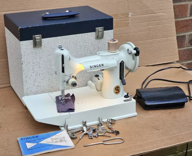 221K White Singer Featherweight Sewing Machine with accessories.