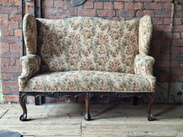 Antique Georgian Style Wing Back Sofa On Carved Legs.