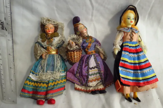 3 small costume dolls