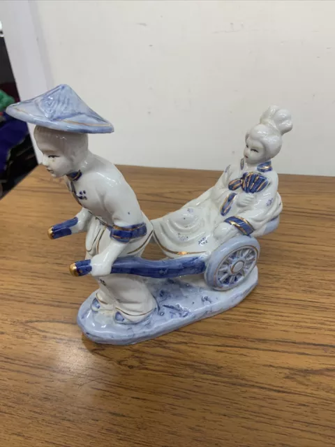 Unbrnaded Oriental Blue & White FIgurine (Man Pulling Lady on Cart)