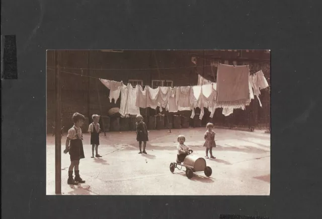 Nostalgia Postcard  East End Slum Children play around washing & Dustbins 1933