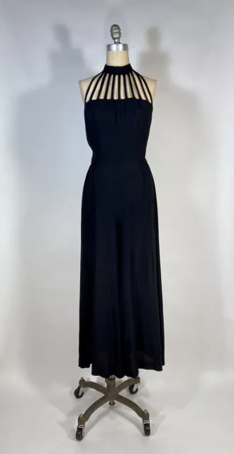 Vintage 1990's sexy black jumpsuit with cage style halter neck & back size Small