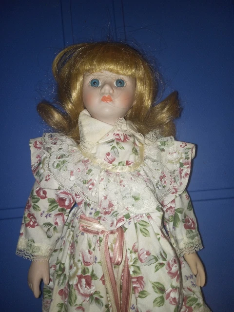 Vintage Porcelain Doll in Rose dress