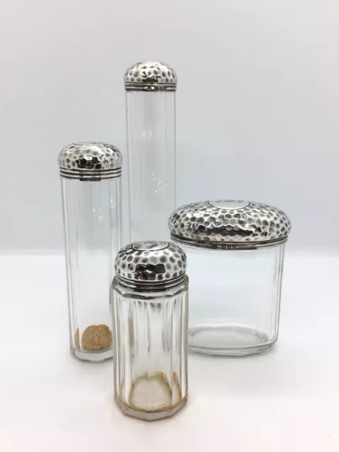 Set of Four Hammered Solid Silver Topped Glass Dressing Table Bottles / Jar