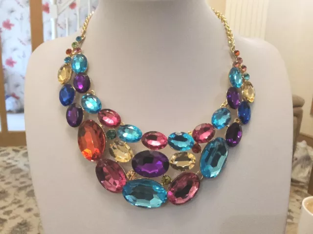 Brand new large handmade gold tone necklace with multicoloured crystals