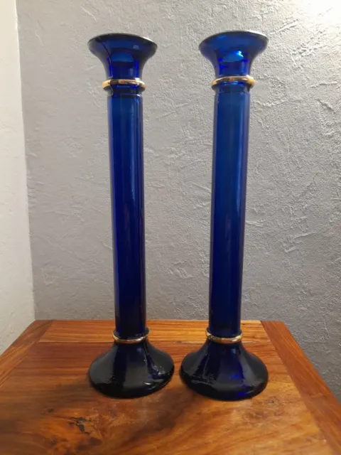 Pair Of Cobalt Blue Glass Candlesticks with gold colour detail, 28cm High