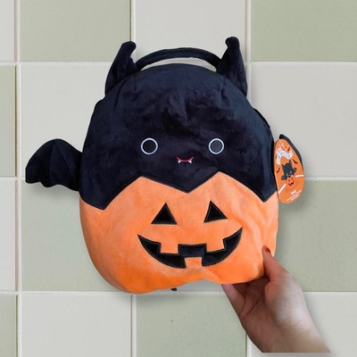 emily in a pumpkin squishmallow