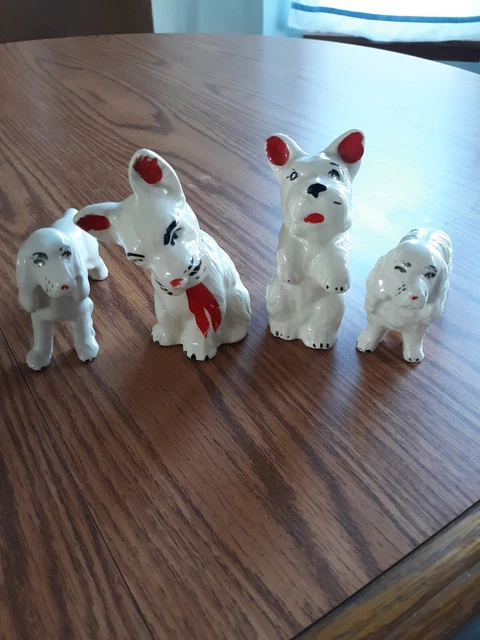 Lot of 4 terrier setter ceramic vintage dog figurines pottery made in USA?