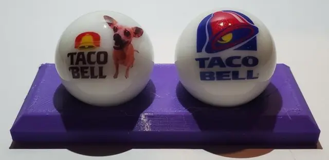 Super Nice Set of 2 Taco Bell Glass Marbles with Stand