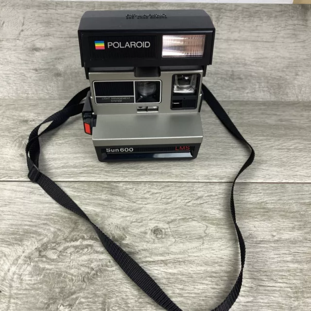Cámara fotográfica instantánea vintage Polaroid Sun 600 LMS con correa sin probar