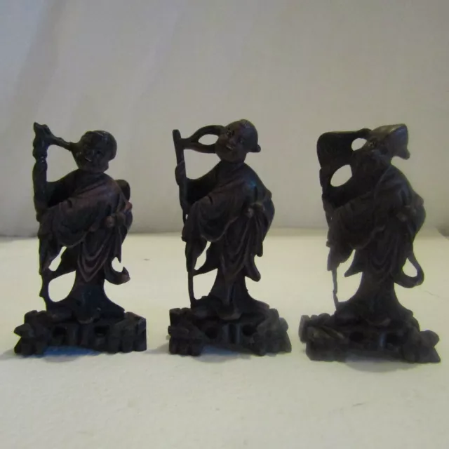 Three vintage oriental hardwood wooden hand carved figures wise men Chinese?