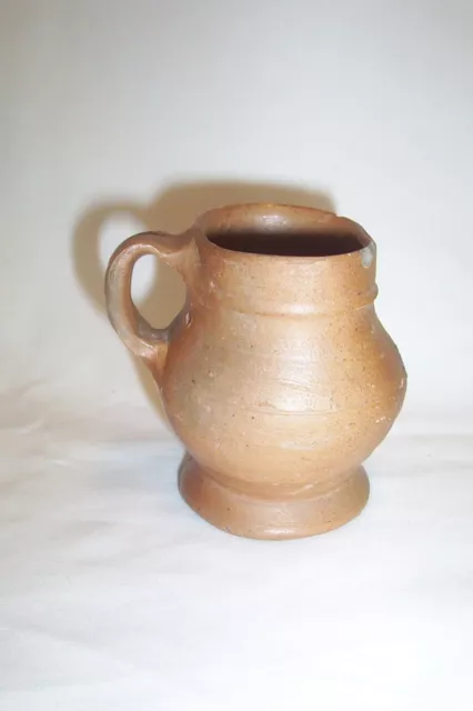 Small Raeren stoneware drinking mug c. 16th century.     Bellarmine krug