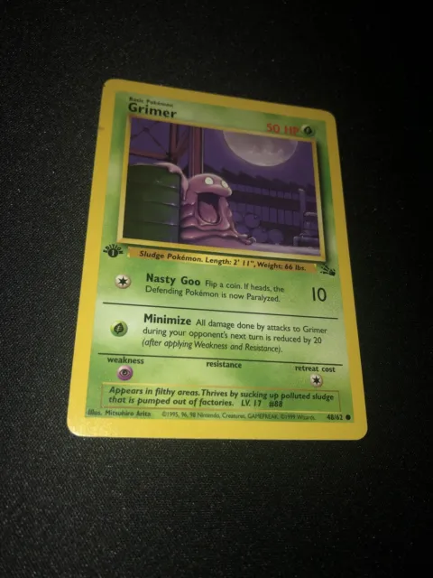 First (1st) Edition Grimer 48/62 Fossil NM Near Mint 1999 WOTC Pokemon Card