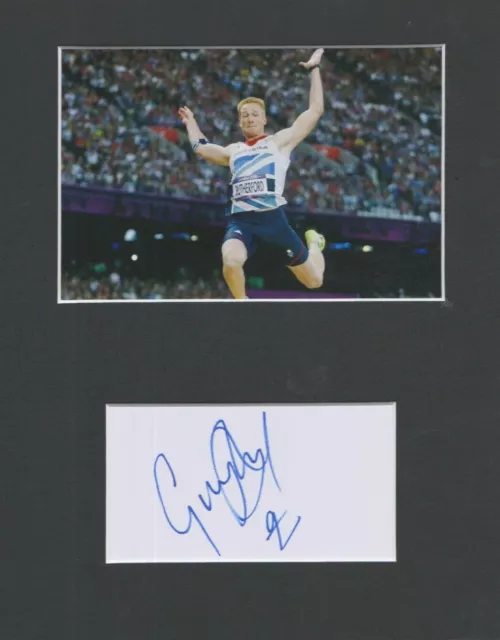 Greg Rutherford    **HAND SIGNED**   10x8 mount  ~  AUTOGRAPHED ~   Olympics