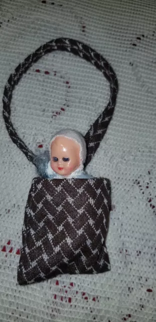 Vintage Hong Kong celluloid miniature sleepy eye dollhouse doll in bag