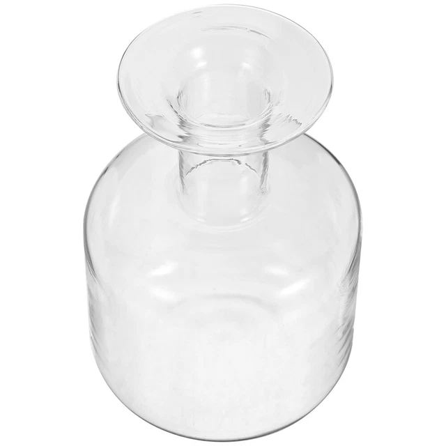 Hermosos centros de mesa de mesa con botella de vidrio transparente botella de flores