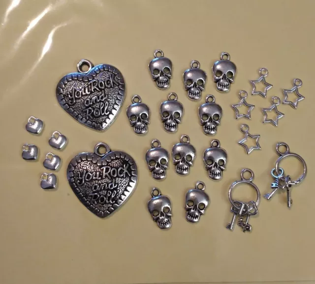 25 pc Mixed Charms/jewellery. Tibetan Silver Rock & Roll Skulls, hearts & star