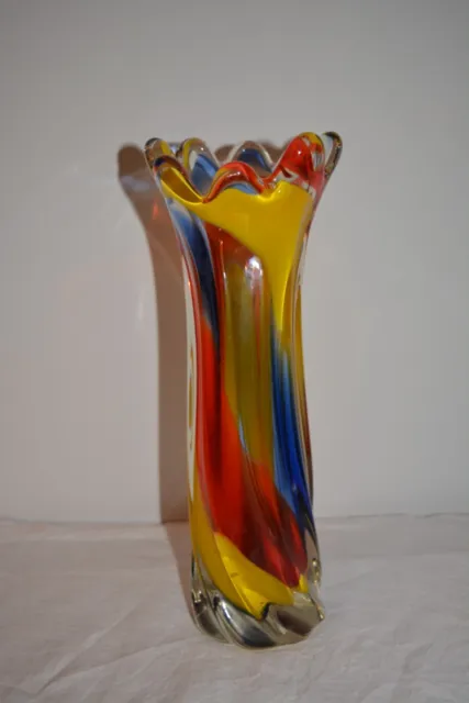 Tall colourful twisted glass art vase, red, yellow, blue, 12”.