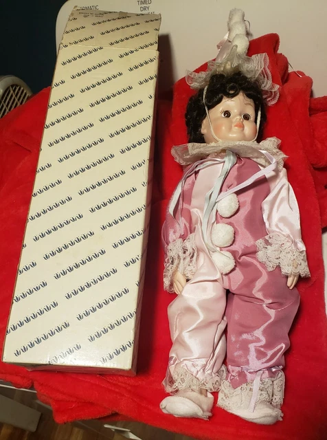 porcelain dolls collectible clown girl with brown curly short hair, pink outfit