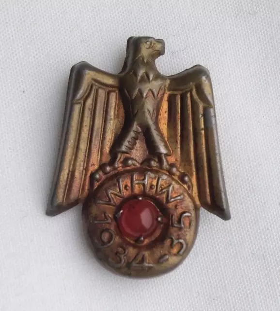 Original German WHW Winterhilfswerk tinnie badge with eagle 1934-35