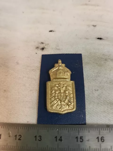 (1566)  Emblem Kolonien für Tropenhelm an Splinten