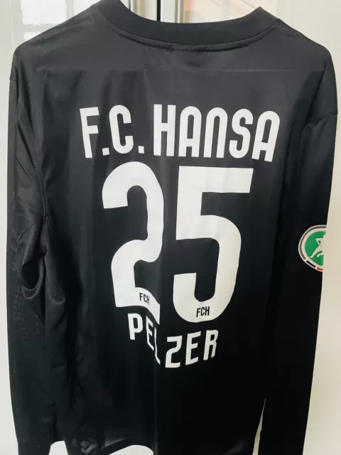 Hansa Rostock Trikot auswärts in schwarz und L mit Flock von Pelzer S. 2