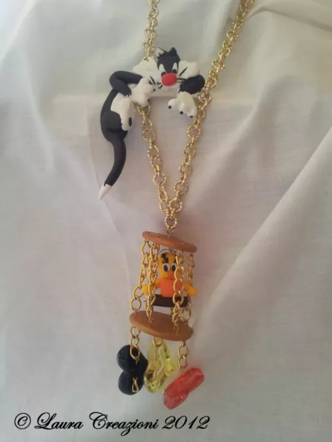 Collana TITTI E SILVESTRO in fimo con perle acriliche e gabbietta handmade
