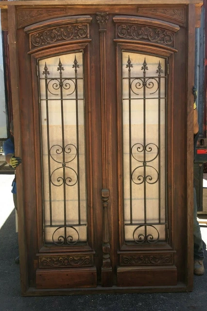 Antique double front door with wrought iron inserts