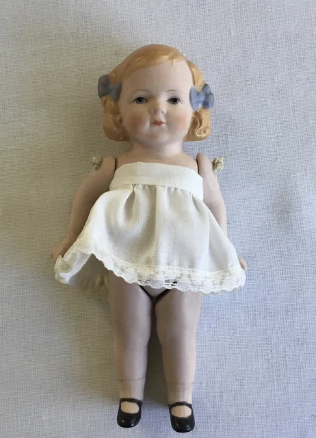 LOVELY VINTAGE BISQUE JOINTED GIRL DOLL Incised “Germany” 6 Inches Tall Hair Bow