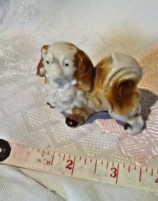 Small Pekingese ceramic dog ornament. Very old but cute! Approx 7cms x 6cms