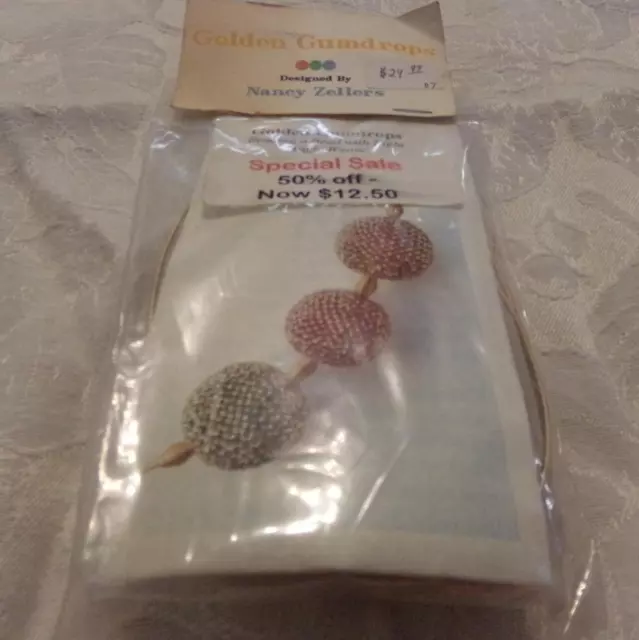 Cuenta de diseño de gotas de goma doradas Nancy Zellers diseñadora con kit de tejido en ángulo recto nuevo sin etiquetas