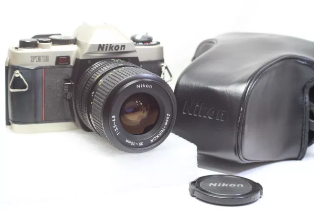 [TAL CUAL] Cámara de película Nikon FE10 SLR de 35 mm + lente Zoom Nikkor...