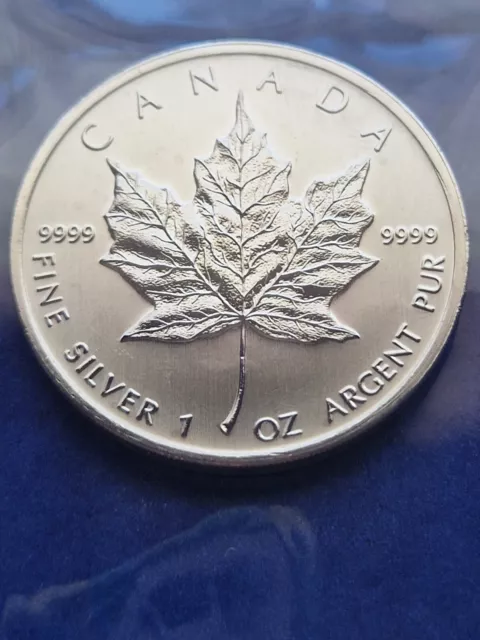 1oz silver canadian maple leaf coin. 9999 fine silver. 2011 available.