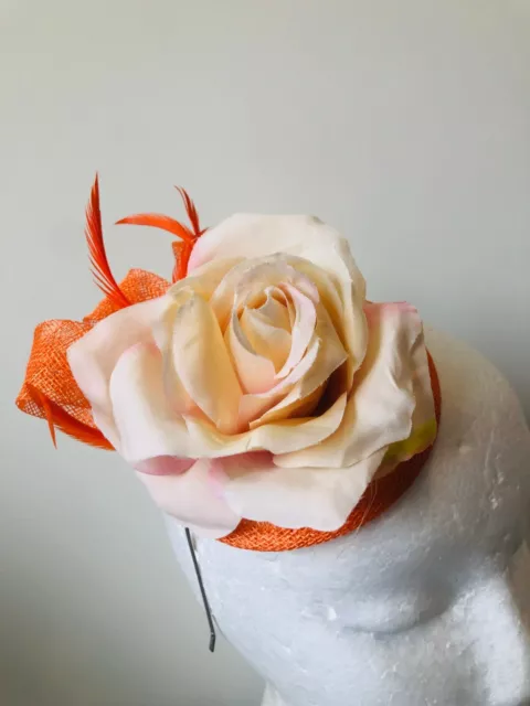 NEW orange round fascinator with loops, feathers and flower on a headband!