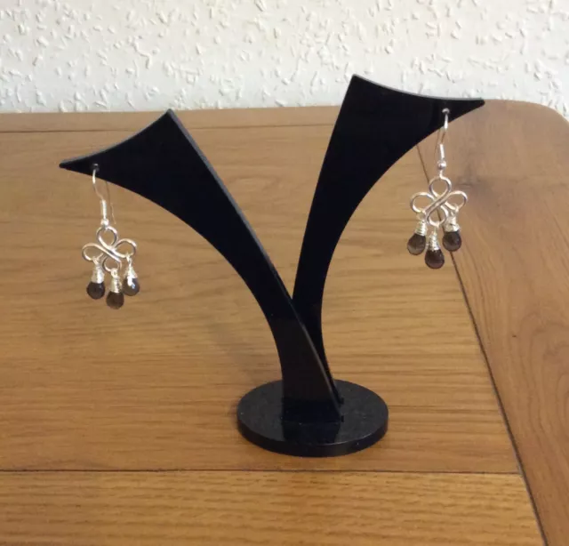 Smokey Quartz Chandelier Earrings. Silver coloured earrings. Lotus themed