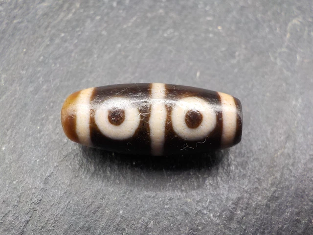 An Agate Dzi bead with a 6 Eye pattern from Tibet / Nepal.