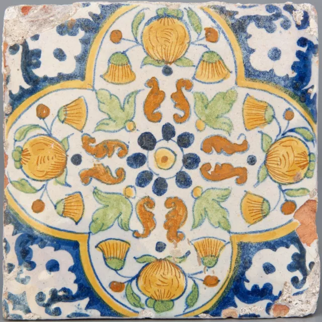 Nice Dutch Delft polychrome ornament flower tile, pompadour, first half 17th ct.
