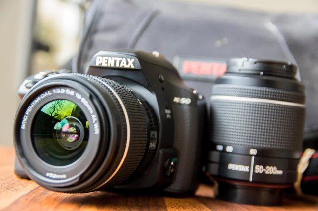 Pentax K 50 + 18-55mm f:3,5-5,6 WR + 50-200mm f:4-5,6 WR + Sac (1380 actuations)