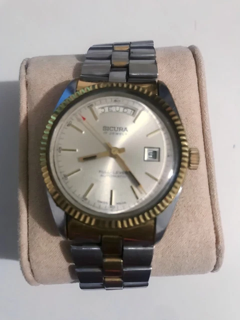 VINTAGE SICURA 2 tone with day and date very rae 200.00