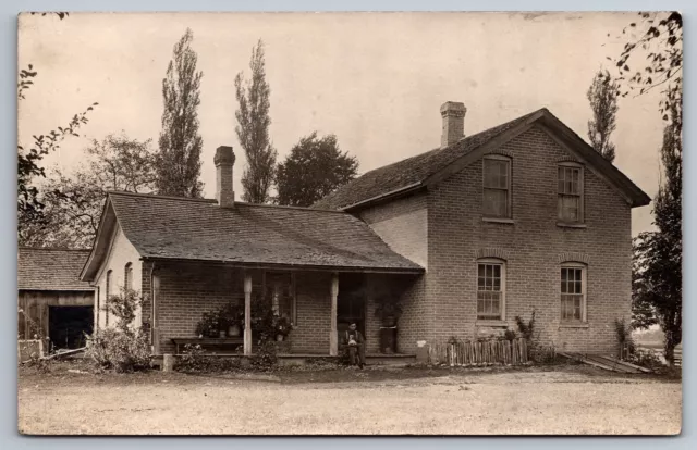 Victorian Era Farmhouse RPPC Man Holding Dog Brick Residence Real Photo Postcard