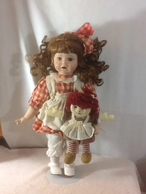 Vintage TL TOYS Bisque Porcelain Doll W/ Red Checkered Dress Holding Rag Doll