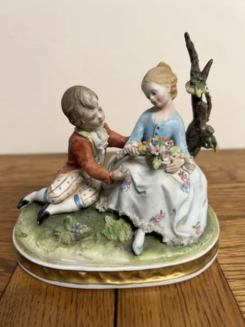 Capodimonte Porcelain Figural Girl & Boy Seated on a Tree Branch back stamped