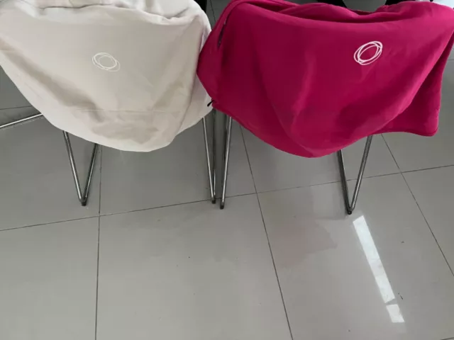 2 bugaboo donkey canopy 1 in pink the other in cream - 40$ and shipment 2 bugaboo donkey canopy 1 in pink the other in cream - 40$ and shipment